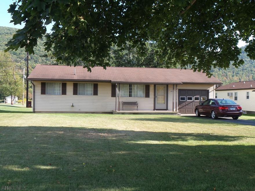 Rare opportunity in Tipton!  One story living - this home offers 3 bedrooms and 1 3/4 baths.  Full basement offers so much potential for additional living space.  Large 12 x 12 covered back deck, with a 75 x 111 lot for your enjoyment.  Central air, paved driveway, vinyl siding and 1 car garage.  Hardwood floors under the carpeting throughout home.  One car integral garage 11'6  x  23'6