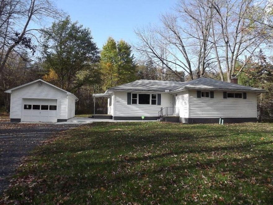 Spacious and move-in ready ranch! Beautiful three bedroom, 2 full bath home with new hardwood flooring, cherry kitchen w/ soft close drawers, and entire home freshly painted! Newer well, 4 exterior doors, windows, new bathrooms, plumbing, pressure tank, hot water tank. Newer interior and exterior paint, lighting, foundation walls sealed and exterior walls painted. Detached one car garage with level lot. A great home nestled among mature trees making a beautiful setting.