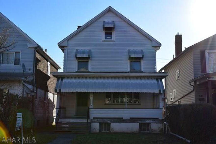 Nice 4 bedroom home with beautiful built in corner cupboards in the dining room. Plenty of natural light. Cover front porch and enclosed back porch. Two car garage off of the alley.