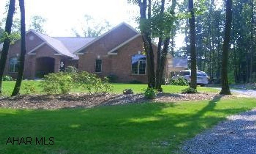 Extraordinary one floor living!  (Did I mention the view of hole 14 at Ironmasters CC?)  Vaulted great room with built ins and gas fireplace, custom cherry kitchen, walk in pantry, cozy hearth/sun room with wood burner. Extraordinary one floor living!  (Did I mention the view of hole 14 at Ironmasters CC?)  Vaulted great room with built ins and gas fireplace, custom cherry kitchen, walk in pantry, cozy hearth/sun room with wood burner.  All tile and hardwood flooring, large deck, covered patio.  WO Basement with full kitchen, exercise room, bedroom, full bath, storage, huge workshop.  3 car garage, central vac, beautifully landscaped with stocked fish pond.