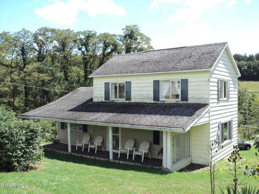 Country neighborhood, relax on the large covered front porch.   There is work to be done but also potential.   The full bath is located on the 2nd floor also a bedroom and open area used as a 'bedroom'. The porch wall is ''faux brick'' the home is being sold as is.  Call for additional home details.