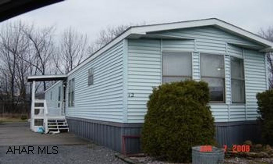 Single wide.  Lot rent $250.00 month includes water, trash, sewer, and snow removal.