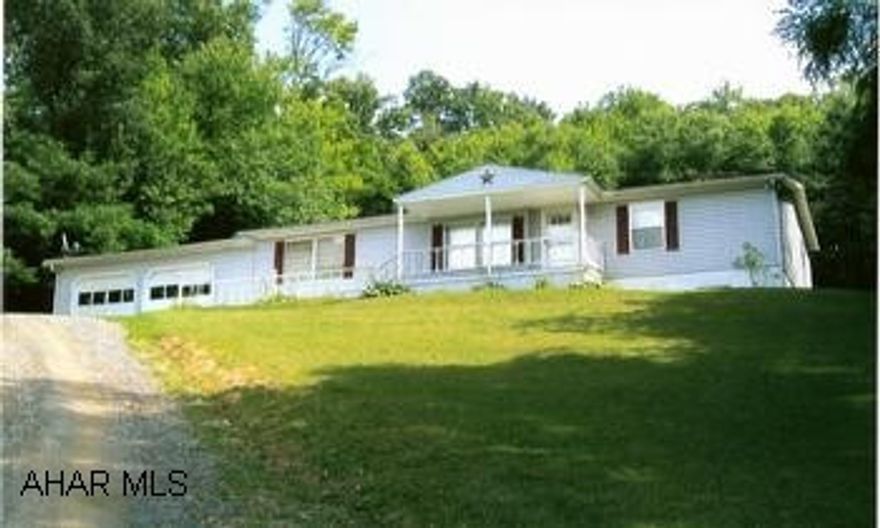 Well maintained doublewide. Includes kitchen appliances (4 years old). New roof and front porch. Roofed patio brightens this shuttered 3BR/2BA home on 1.07 acres. Private drive, two-car garage. Easy-out sliding glass door, walk-in closets, a convenient main-level laundry, modern kitchen with all appliances. New roof, siding and front porch, garden space and full open basement. Close to I-99. An excellent value!