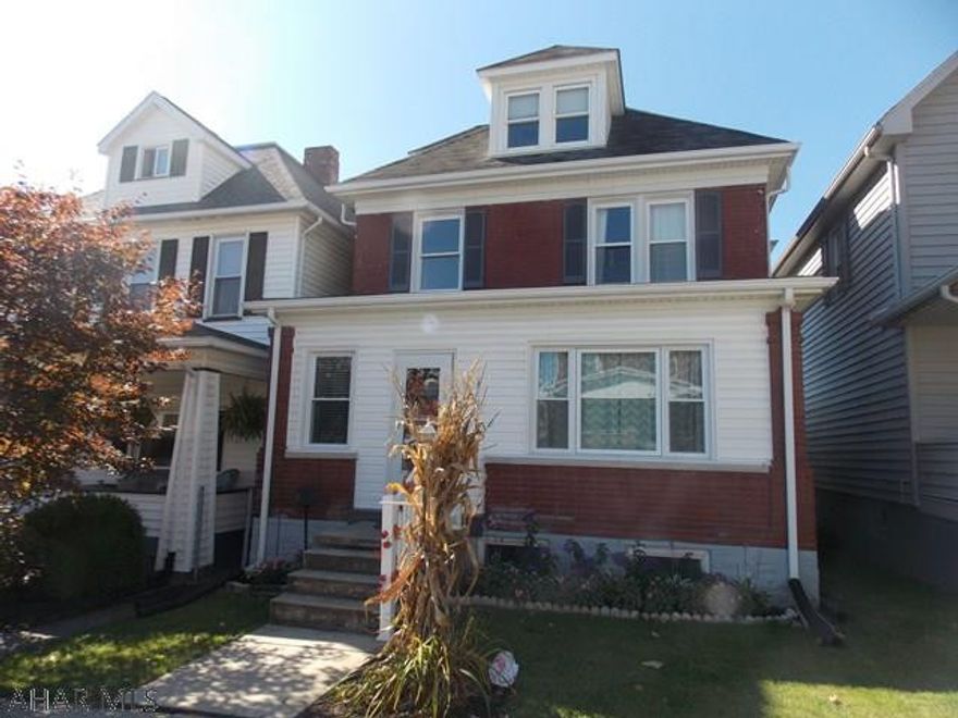 Charm and character galore in this beautiful well cared  home. Lovely hardwood floors & moldings & a stunning front door surrounded by glass greet you as you enter the home. The front porch has been closed in & is heated for extra living space.  The bedrooms are all freshly painted &  have new carpet. The 3rd floor is being completed as the 4th bedroom it is large enough for 2 kids.  The kitchen &  bath have been updated as well.  New appliances in the kitchen & the bath is large with a soaking tub, walk in shower & two sinks. The large covered deck is a great place to entertain in nice weather or just to sit and relax on warm evenings. The back yard is fenced in & there is off street parking for two cars. This is a great home on a lovely street.  Don't wait call today for your showing.