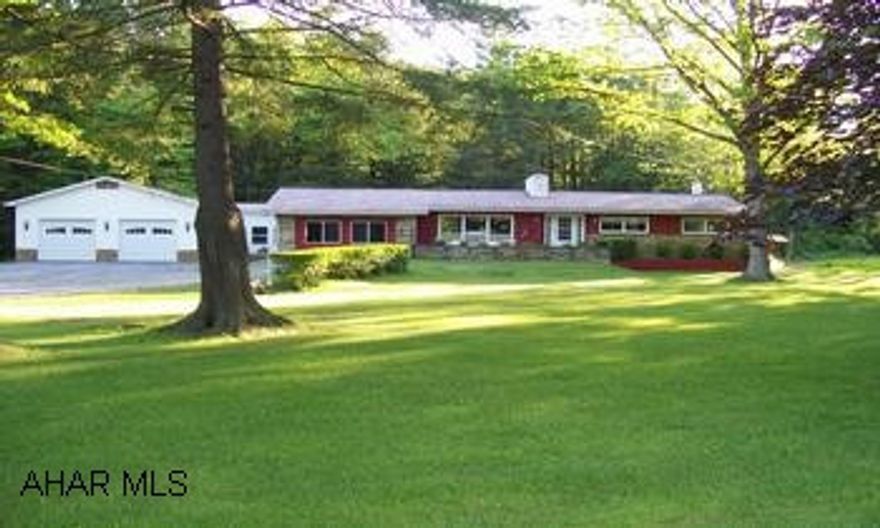 nice ranch on 2.1 acr., large gameroom and overside 2 car garage, Hardwood floors under carpet,new heat pump with central air,fireplace,1st floor laundry, new rec room with bar, two kitchens