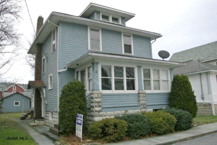 Meticulous 3 bedroom home with lots of charm.  Original hardwood floors, two enclosed porches for bonus rooms, very spacious interior.  Newer furnace.  Also features two garages on this large parcel.