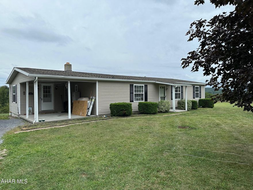 Double-wide manufactured home resting on 2.029 acres. Three bedroom, two bath, kitchen, living room, dining room and laundry room. Full unfinished basement, oil forced air heat, central air, public water and public sewer. Good views of the surrounding countryside. Comp purposes only.