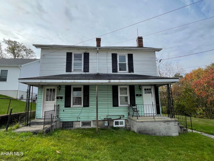 This large duplex sitting on a double flat lot was gutted and the right side unit was completely renovated with all newer windows, updated kitchen and bathroom along with all new flooring. Here is your opportunity to live in one unit renovate the other unit and have tenant pay your mortgage.