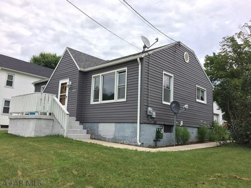 This cozy 2 bedroom, 1 bath, well maintained home sits on a corner lot in Cresson Township, features updated kitchen and bath with tile flooring and hardware throughout living and bedrooms, new roof windows, furnace, hot-water tank and newer siding. Completely move in ready. Must See.