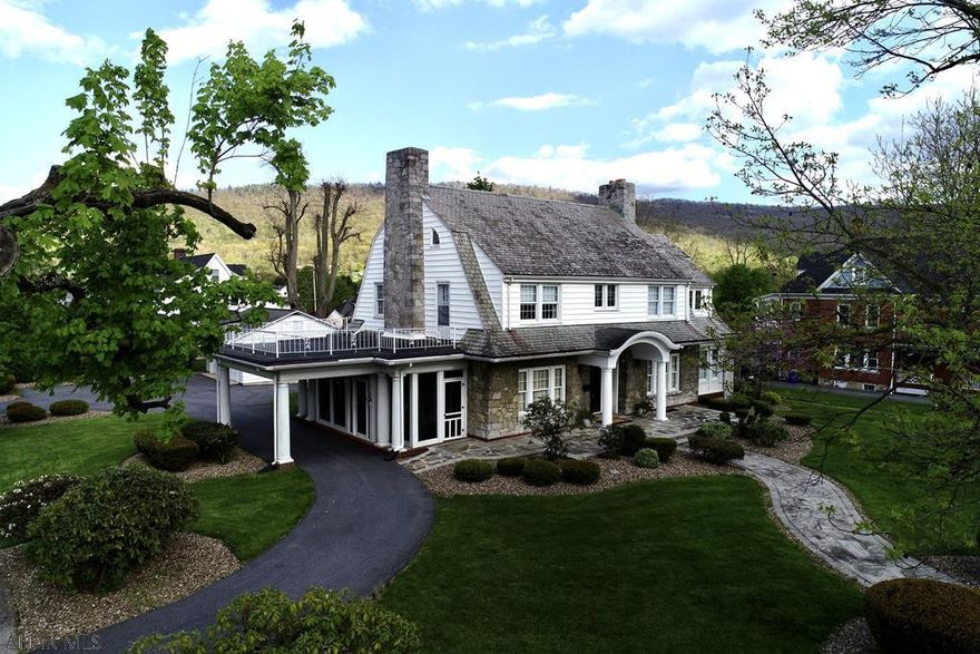 Once described as a home that just makes you smile!  It simply evokes a wonderful emotion as you enter and are mesmerized by its outstanding architectural moldings, flooring and French doors.  This is a home to treasure as it blends historic elements that are beautifully restored and renovated.  There is a charm that cannot be overstated as its light filled rooms add to the home's warmth.  Energy efficient natural gas heat and 4 car garage add to its appeal in this walkable location.  No detail was overlooked in its creation and it will appeal to the most discriminating buyer.  This home is well known for it significance as a beloved Bedford landmark.