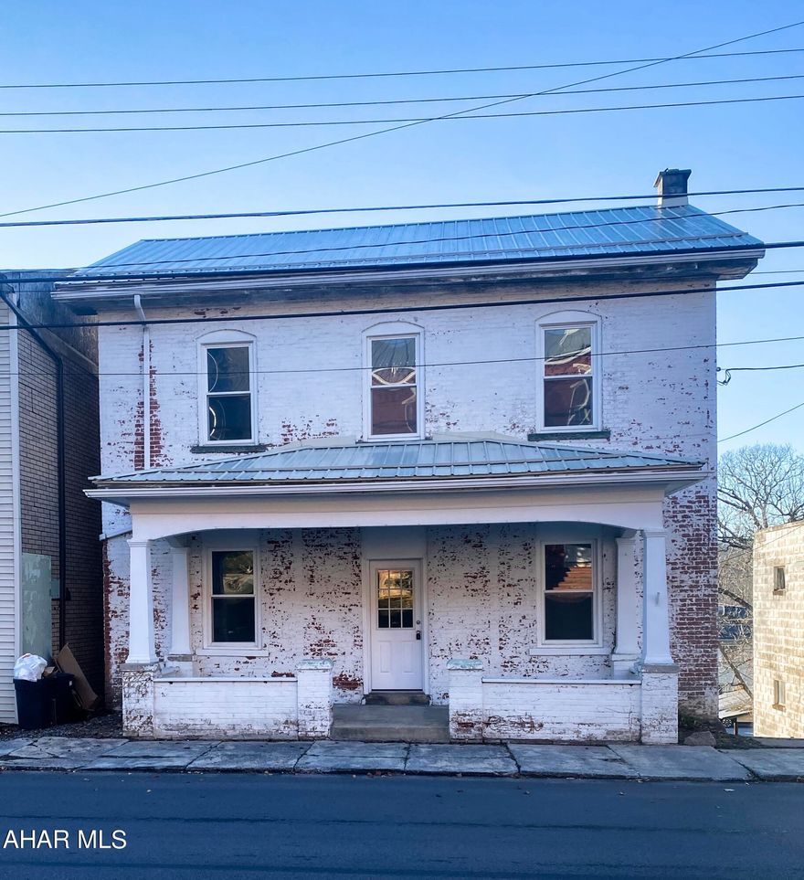 Pack your things. This home is ready to move right in. This 3 BR, 1 BA brick home features Refinished original hardwood flooring throughout, every room freshly painted, built-in shelving, and new doors/closet doors, You will be wowed by the new kitchen with stainless steel appliances and the new bathroom with space for a second floor stack laundry. The radiant floor heat on first floor will keep those tootsies warm on those cold winter nights. Enjoy a large yard with off-street parking and a covered front porch and back porch. The exterior paint is included with an acceptable offer to spruce up your curb appeal.