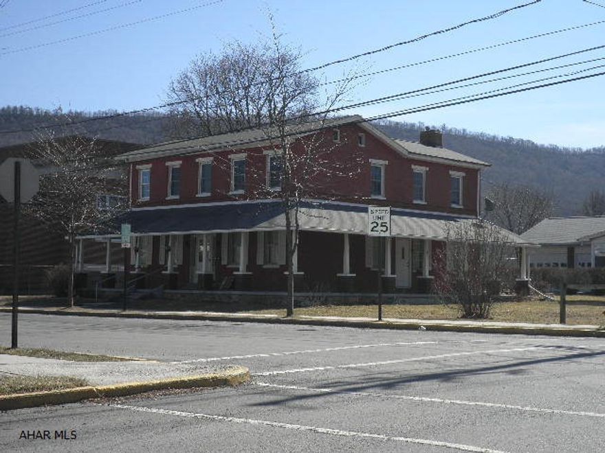 Nice in-town setting.  1996 - New oil hot water furnace and baseboard units - shingle roof.  Newer concrete sidewalk and parking pad. Full basement, 2-100 amp services, 2-water meters, 2-water heaters, wraparound porch.  Zoned R-1 Single-Family Residential & Historic District. Previously used as two apartments; if not in use as 2 apartments by October 1st 2012, will have to revert back to single-family use.  Would make a lovely single-family restoration project.   Great location!  Underground heating oil storage tank.