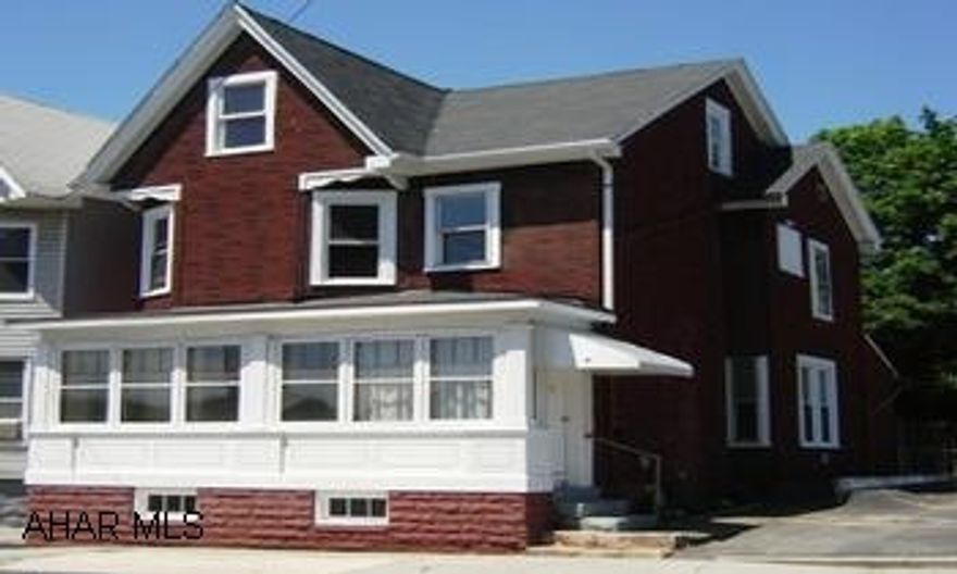 New Everything inside! Outside needs TLC.  Can't tell a house by its cover - this is a must see!  New carpet, new bath, furnace, new breakers, 8 new windows!  Bank has given permission to use parking lot for owners to park vehicles - at side of house - as off street parking.