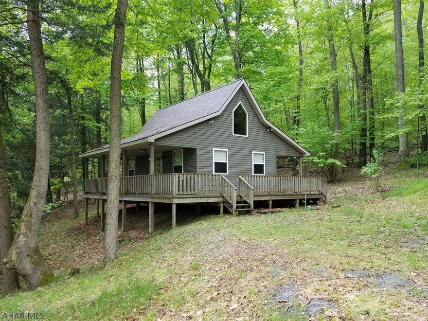 Charming little cabin in the woods at Glendale Yearound. 2 bedroom and 1 bath. BRAND NEW!!! WASHER AND DRYER INSTALLED. Kitchen and Living Room combo. Beautiful cathedral ceiling! Wrap around deck with deck add on gives you plenty of room outside for outdoor cookouts, parties, and get togethers. Perfect weekend getaway! Glendale Yearound is a gated community minutes from Glendale Lake, Prince Gallitzin State Park, and Rock Run ATV Park. Community Pool, Tennis, Basketball, Security, etc.