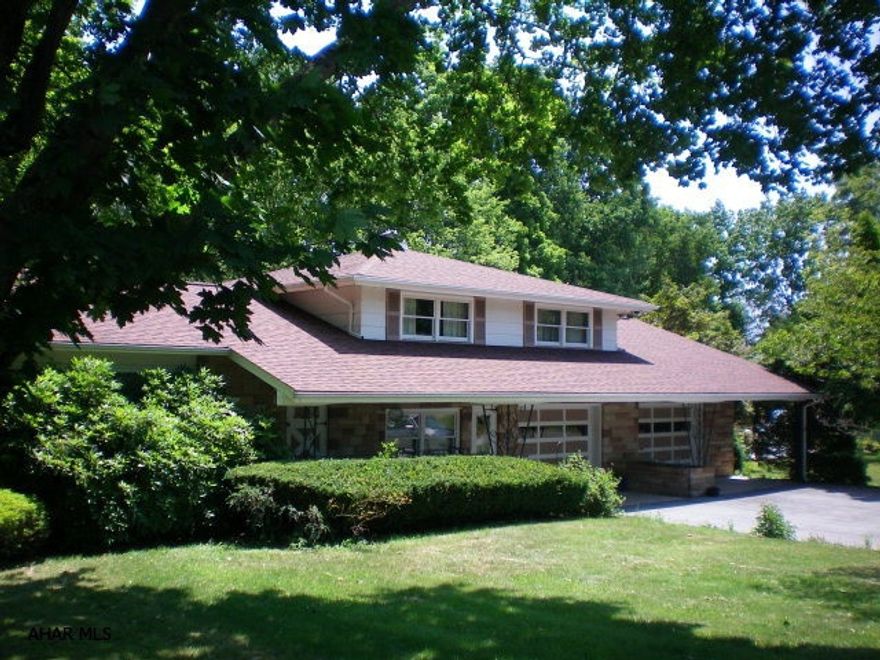 Well built sandstone multi level on two large ots in Logan Twp. Newer windows and roof, beautiful in ground pool, private patio, huge 2 car garage and a great location near Ebner School. Elevation survey done and this home is now out of flood plain! FEMA certification agrees.