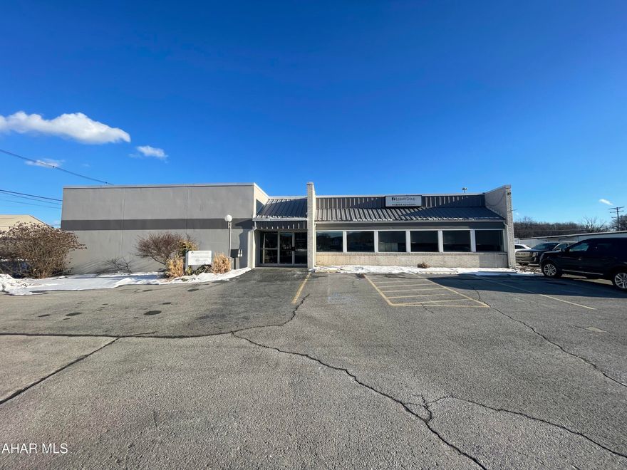 Professional office building with 2 units. 7306 square foot total. Common area between the units is 190 sq ft. 101- has reception area, waiting room, 7 offices, two restrooms, conference room, kitchen/breakroom, and open area that could serve as addtional meeting area. 4,380 sq ft. 102- This unit has a ramp that leaves to open area. Cabinets for storage. 4 offices for privacy, kitchen, two bathrooms, shower room, and walk out area. 2,736 sq ft. Basement is unfinished and great area for all your storage needs. Ample parking. 20 spaces.