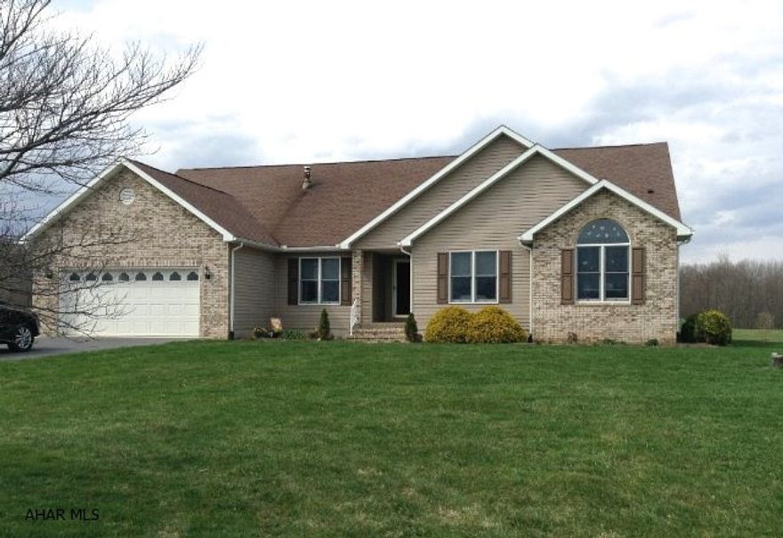 Impressive upscale ranch house on 10.45 acres! 3BR/2 full baths with designer quality touches throughout. Custom kitchen with solid cherry cabinets and breakfast bar. Formal dining room has tray ceiling. Sunken living room with cathedral ceilings and lovely fireplace. Office area with French doors. Main floor laundry room. Double doors lead to the large master suite. Upscale amenities include recessed lighting, ceramic tile. Anderson windows, solid oak doors, vaulted ceilings, walk-in closets. Covered porch, large landscaped yard with large vegetable garden and wooded acreage. An additional 2300 sq/ft. lower level with very high ceilings offers tremendous opportunity. Scenic country setting. See the narrated visual tour to fully appreciate this incredible home.