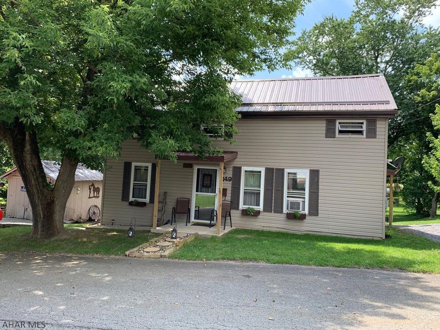 A quaint and nicely maintained home give you all the comforts of country living at its best. Maple kitchen cabinetry, gas stove and a side by side refrigerator, decorated with matching curtains and rugs! The living room features built in pine shelves and pine walls. The upstairs has 2 bedrooms, and office/den/closet and 1/2 bath.  If you like to entertain outside look no farther. 16x30 in ground pool with a 12x24 screened in porch for picnics and relaxing.  Nice backyard for recreation and a garden shed for all your outside gardening and landscaping.  Beautifully landscaped!!  A Natural Gas line installed so you can convert easily.  Electric junction box on side of home ito provide additional electric if buyer wants to add a new garage or outbuilding.