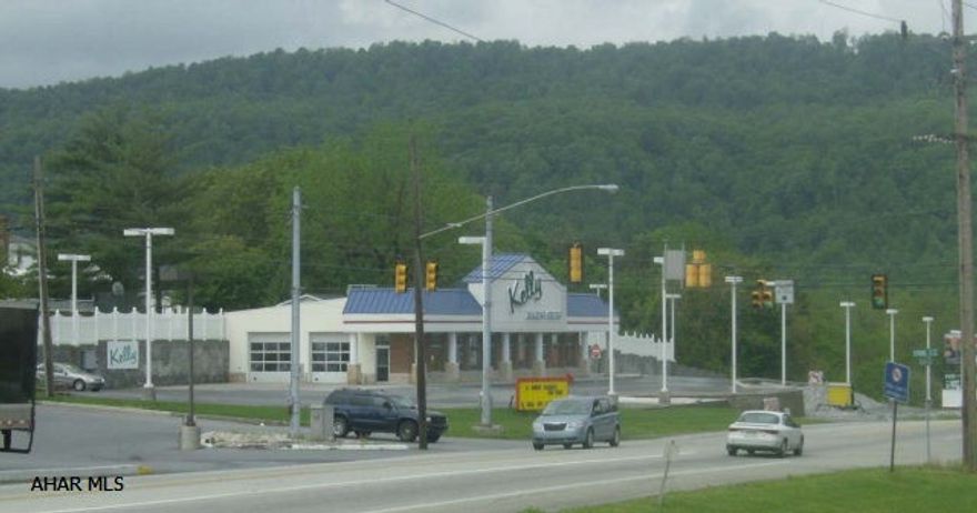 Modern 3200 sq. ft. commercial location.  Former auto dealership on 1.4 acre corner property with signal light.  Easy access, high visibility, 21,000 daily traffic count.