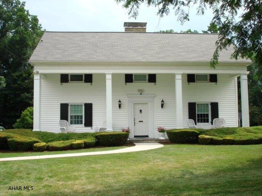 This distinctive  home was planned for gracious living. The formal living room offers a warm & welcoming fireplace. The dining room adds elegance to everyday dining. The beautifully designed kitchen is a dream come true. There are hardwood floors under the carpeting throughout the house. The basement is partly finished and offers another fireplace.  With its picturesque setting, its manicured lawn, professional landscaping and ideal location, it is a property often sought after but seldom found. This property was once featured in the Better Homes and Gardens Magazine.
