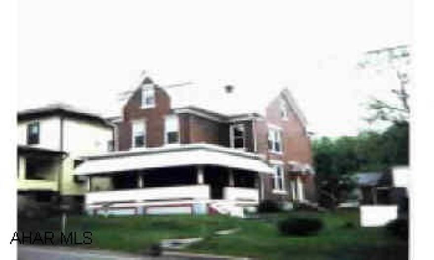 Two story brick with 3 bedrooms, central air, two car garage, new windows, large corner lot, greap potential. Commercial zoning. Two story brick with 3 bedrooms, central air, two car garage, new windows, large corner lot, greap potential. Commercial zoning.