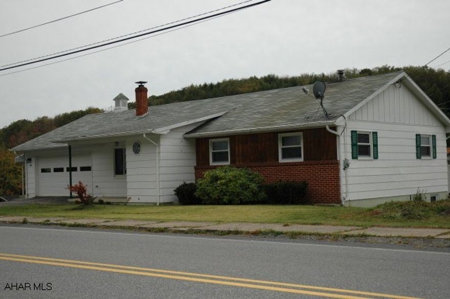 Own this 1-story home with spacious living room, kitchen, 3 Bedrooms and large bathroom.  Carpet is newer, all windows have been replaced.  New hot water boiler furnace, all new oil tanks (3), updated electric, 80 gal water heater (new), new metal doors and closet doors.  Huge basement with bathroom (shower), walk out from basement to large lot.  Large 2 car attached garage.  Interest rates are low - now is the time to buy and be in for the holiday memories!