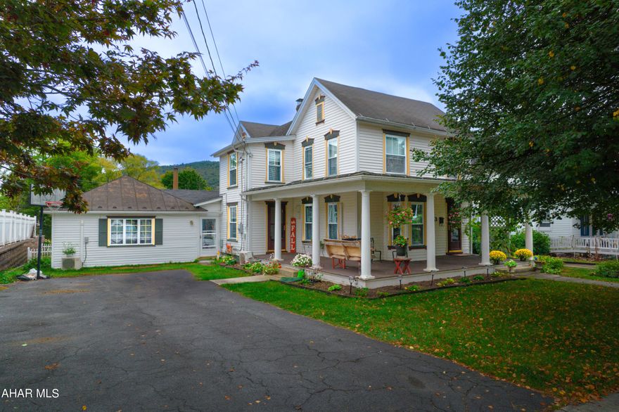 Get ready to FALL in love with 433 S Juliana Street! Discover the charm of this expansive residence nestled in the heart of Bedford Boro. It boasts a sizable recreation room adjacent to the kitchen, complete with a cozy wood stove. The kitchen offers ample storage and a pantry, along with plenty of counter space for meal preparation. Enjoy the convenience of a first-floor master bedroom with an en suite bath, and a laundry room also on the main level. The elegant dining room and living room feature hardwood floors that lead to a wrap-around porch.  Half bath off living area. Upstairs, four bedrooms await, alongside an extra sitting area with a coffee bar. There's also a full bath on this floor. Outside, relish the screened porch that opens to a deck, and a flat, fenced-in yard. Just few blocks from downtown Bedford and walking distance to Bedford Middle and High School.  Welcome Home!