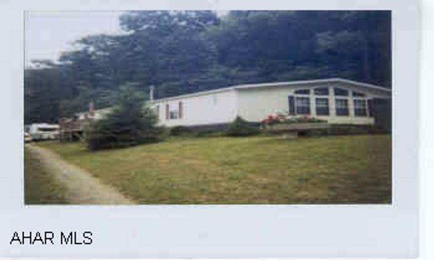 Property adjoins State Game Lands!  Won't last - 1990 lg. double wide home in excellant condition.