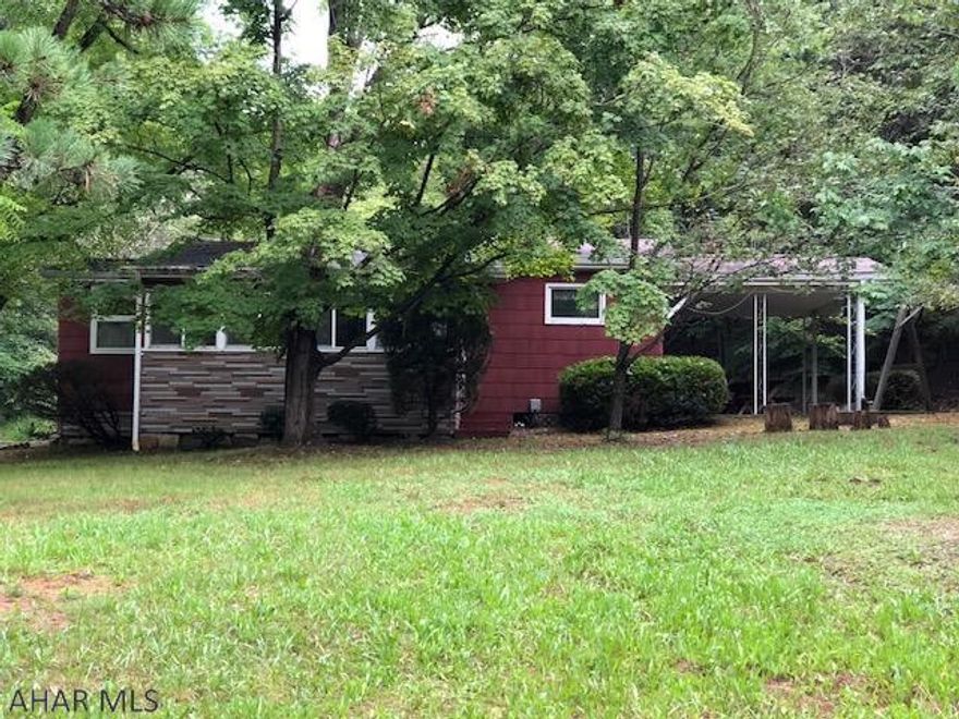 Lovely home away from home. 2 bedroom 1 bath home with 2 car detached garage. Also included A 1994 Jayco model 34 FKJ with slide out kitchen. Camper is 34.5 ft long ,Deck is 10x36 under roof and screened in. Also a new detached bath house. The home has a covered patio for entertaining, large living room, fully equipped kitchen. The home is less than two miles from Lake Raystown.  Lovely setting, perfect for year round living or as a vacation home. Also offering a storage shed and a large detached garage.  This home would make a great hunting camp.