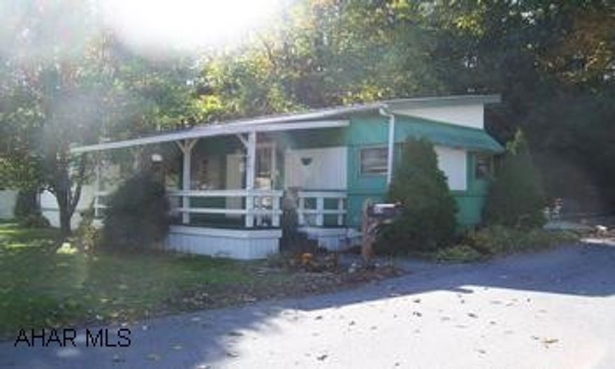 Great Income Producer!  Mobile Home Court, Located near downtown Everett. Property Includes:  (1) 1969 12x60 single-wide trailer with addition rooms, laundry and storage area, screened in back porch and large front porch. Nice pallivion, 1 car garage, carport, 8x10 storage shed and storage building for firewood.  Plenty of paved parking, city water & sewage. The court has 5 lots, 4 are occupied and rented.  3 lots tenant owns their  own mobile home and rents lot. Current owner owns trailer and rents it out. All lots have signed contracts.