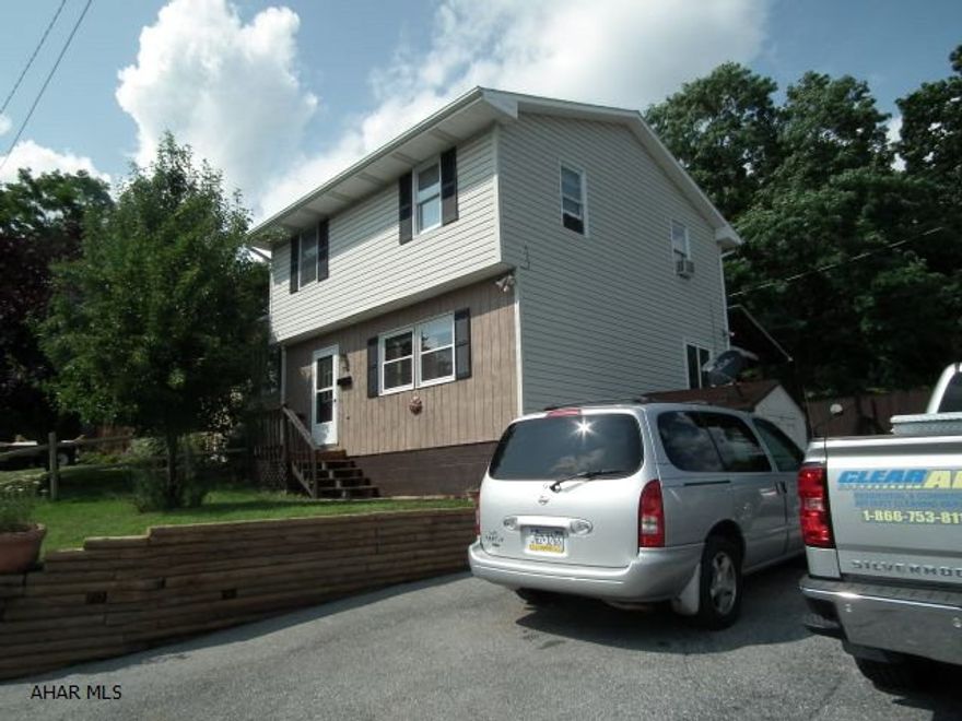 This 3 bedroom is located close to McAuliffe Heights Charter School. It is uniquely 1 of 2 homes on that block. Enjoy the large freshly painted living room for family entertaining. Open floor plan in kitchen allows cooking/serving to eating area in kitchen. Off eating area is double hung doors to deck (large) and fenced in yard. This home has a laundry shoot for easy laundry gathering. Open area on 2nd floor leads to 3 bedrooms. Parking no problem!This home has a 5 car parking lot! Playground across the street from this home gives additional play entertainment for family or visiting children. Home has 2 sheds, pear tree. Camper no problem, an additional feature is a 30 amp hook-up outside for campers!