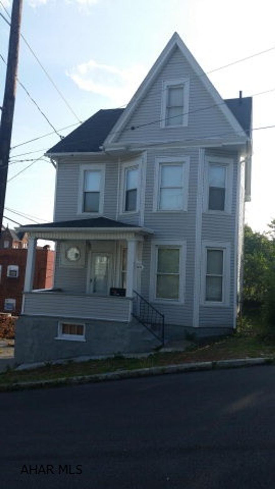 This is a great investment property currently rented for $750 per month. Nicely updated 5 bedroom home! Home features many original charm with several modern updates. Third floor beautifully finished for master bedroom with sitting room, or 2 bedrooms (1 captive). Call today for your showing!