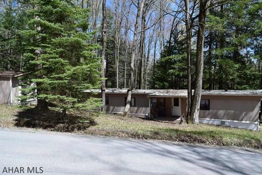 Turnkey vacation getaway in Glendale Yearound. Storage shed for your equipment. Enjoy campfires by your fire pit backed up to the woods and only a short distance to the lake. You will have access to all the amenities the community has to offer. Come for a visit today.