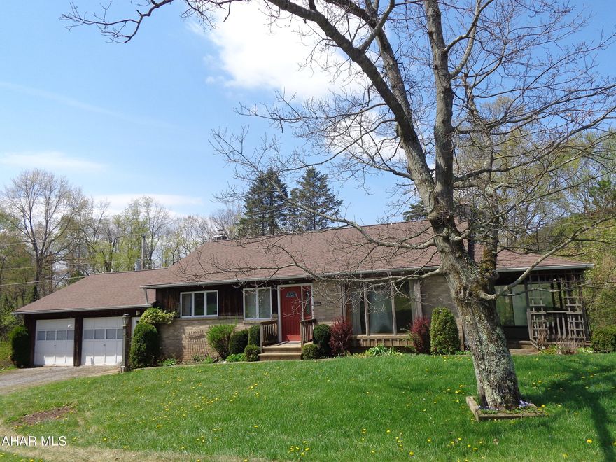 Lots to LOVE here with this Ranch home in the Hollidaysburg School District that offers convenient one story living with well organized living space.   10 minute drive to Blue Knob Ski Resort.   Country living at it's best on 1.36 acres. 
2 car garage, 1st floor laundry, shed attached under the garage,  finished basement family room with wood burner, workshop area in garage.  
The spacious attic is perfect for plenty of storage.