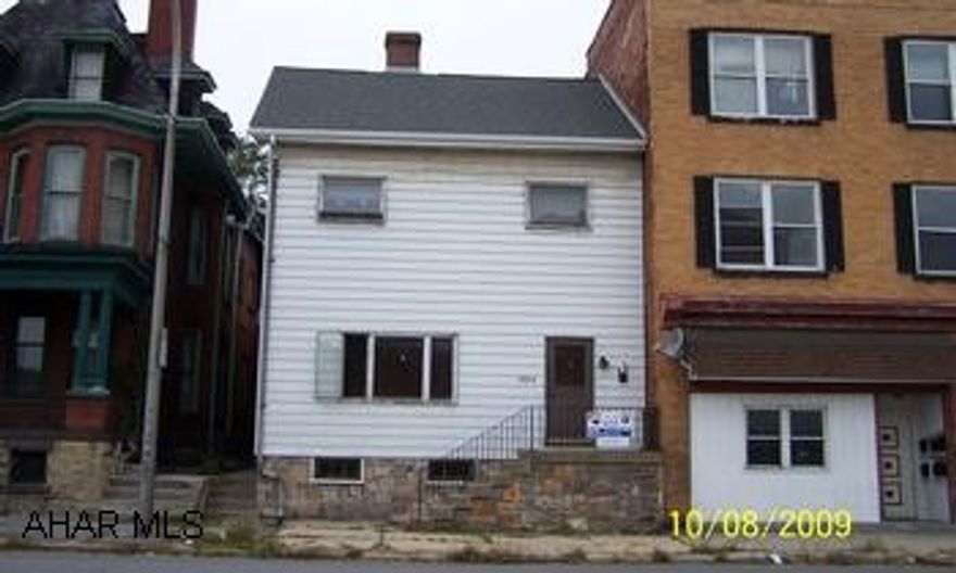 Commercial property in the city of Altoona, Upstairs tenant pays $500.  Downstairs needs to be renovated. 2nd floor is rented on a month-to-month lease for $500/month.  Downstairs needs to be remodeled.  It could also bring $500/month.  Owner pays heat & water.  New Roof in 2007.  Fence added in back yard in 2009.  Gas hot water heat. One refrigerator, 2 stoves included.  Upstairs 2 bedroom apt, Downstairs 3 bedroom apt or business.