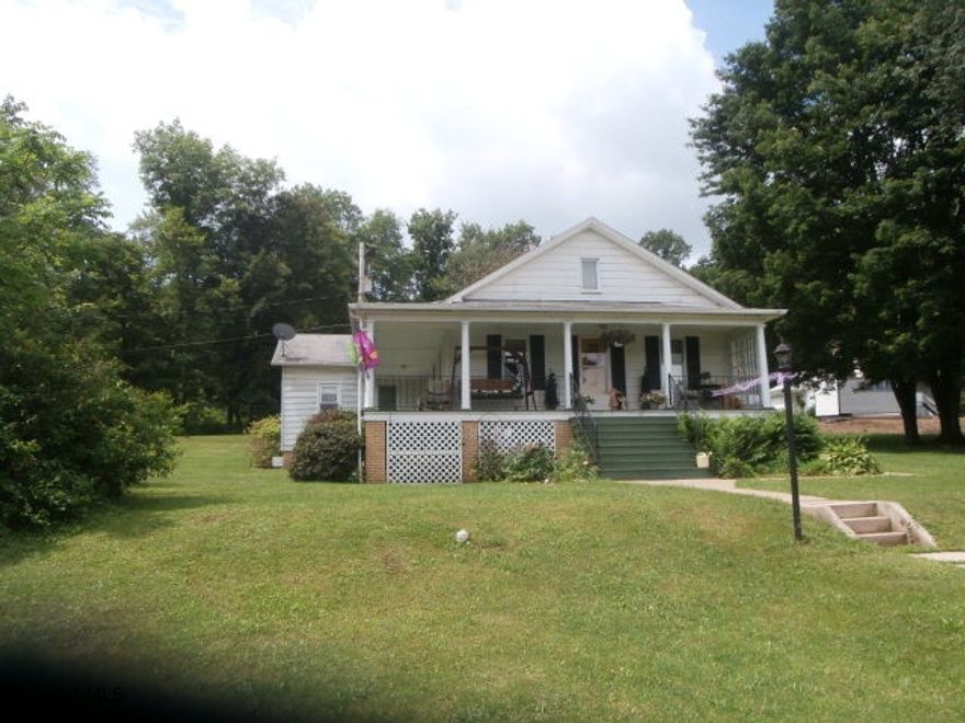 Well maintained one story home on a corner lot. Interior is in good condition with large living room, nice den, dining room, full basement with 1/2 bath - move in condition!! Wrap around porch. Great home for the $$.