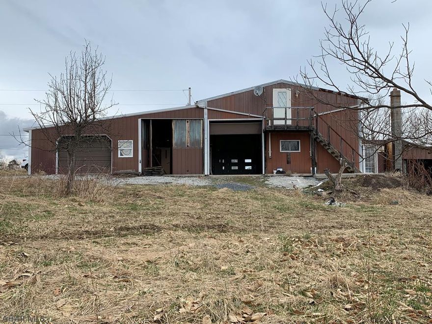 The possibilities are endless on this wonderful 10 acre tranquil site surrounded by panoramic views and orchards.  The site contains water, septic, electric and heat.  Also, the building sits on a huge cement pad.  The property is selling "as is".