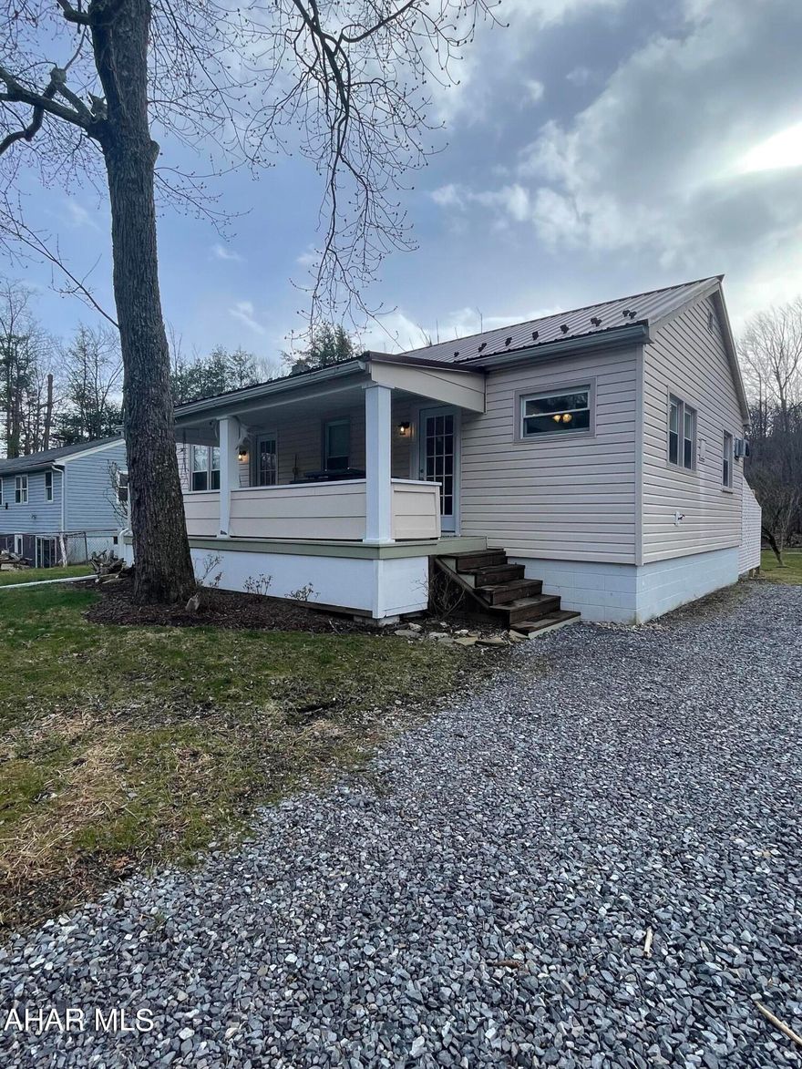 Don't miss the opportunity to view this beautifully remodeled home on 0.38 acres. Hardwood floors throughout, new light fixtures, eat in kitchen with hand crafted back splash, built in air conditioners throughout, a covered front porch, a back deck, off street parking and a shed.  This home could be your  primary residence, your home away from home or an Airbnb.  If you are the avid fisherman, this is the place for you.  This home was previously 3 bedrooms, could easily be converted back to 3 bedrooms if desired.