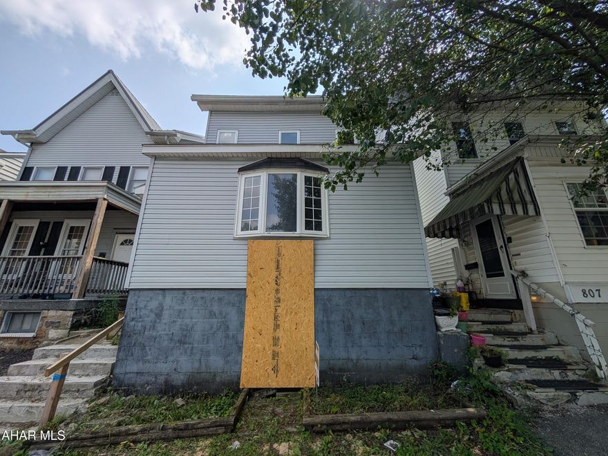 Altoona vinyl two story home. Needs major repairs. AS-IS sale. Seller will make no repairs.