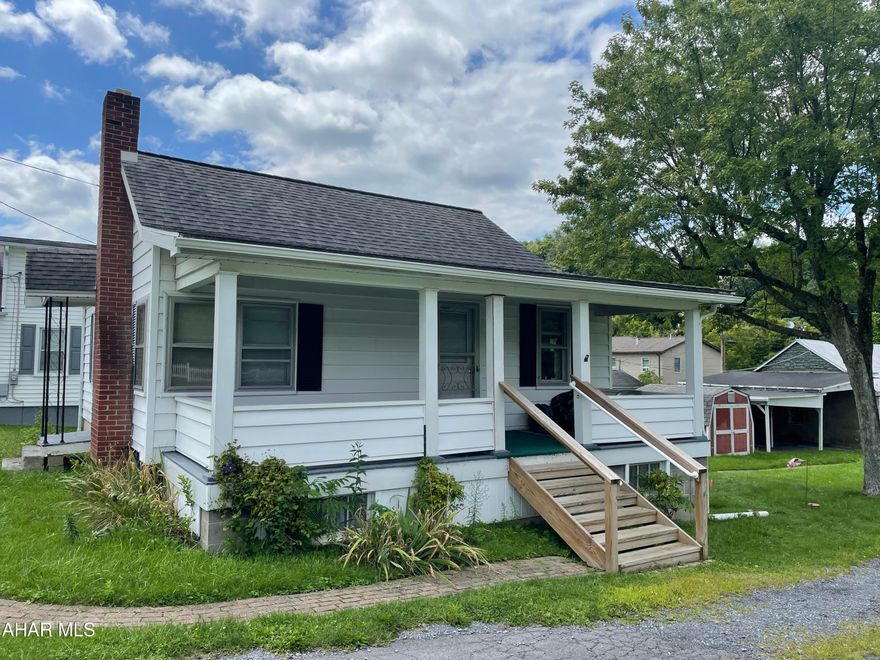 Great starter Home. 2 bedroom  1 bath home Located short distance to town and all amenities. large porch, country style kitchen, full basement, Shed and  over sized detached 3 car garage with 2 carport spaces. Needs updated but in very good condition.