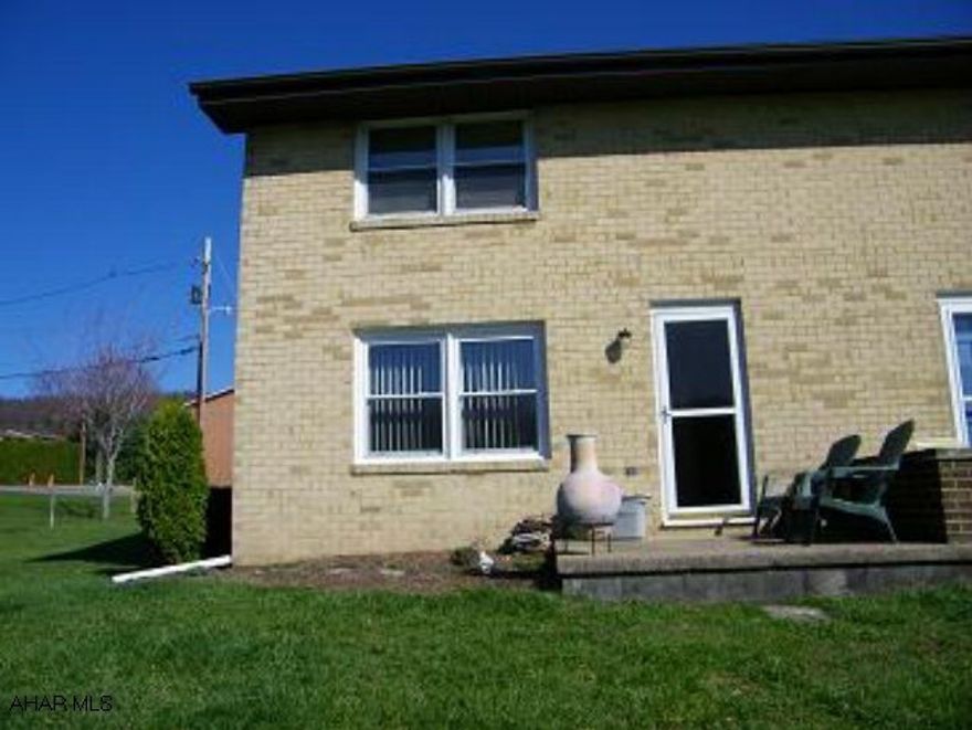 The ultimate in carefree living at Maple Hollow Townhouses. Marvelous 2 b/r end unit with updated kitchen-oak cabinets, ceramic tile, island.  Finished basement with bar, A/C. Most appliances stay.