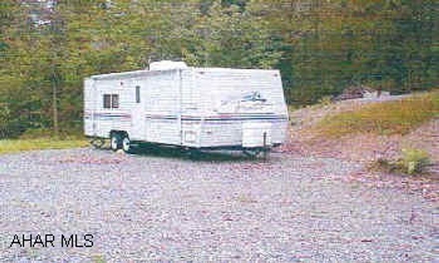 Beautiful 1999 Prowler (camper) on deeded campsite w utilities. Gated community, call listing agent.