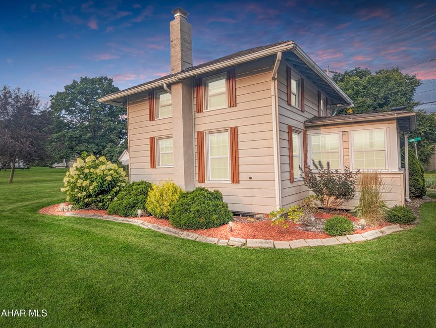 This adorable, cozy cottage style home in the heart of Cresson is situated on a large corner lot, close to everything yet it feels like its in it's own corner of the world! The property is beautifully landscaped around the house, driveway and oversized one car garage. The home ''feels'' like home as soon as you step inside. It features a bright and airy sunroom, living room and an eat-in kitchen with a desk area. Upstairs you'll find a cozy reading nook, perfect for a desk or small table and chair. The spacious bedroom features a vaulted ceiling and built-in closet. There is also an updated bathroom with a marble sink and tub! If you want to build an addition, there's plenty of room on the lot to do so!  And, if that's not enough... This property is also zoned commercial so businesses are welcome! There's a new Dunkin Donuts going in across the street. Sheetz, Rite Aid, McDonalds, Dollar General, a grocery store, local restaurants, banks and Mount Aloysius College are all within walking distance. The house has been used as a successful rental property for the past few years so you could rent it out or buy it and make it your own! Newer roof, furnace, hot water heater, windows. Workshop in garage. Newer zero turn mower and push mower are included with a full price offer! (Property virtually staged)