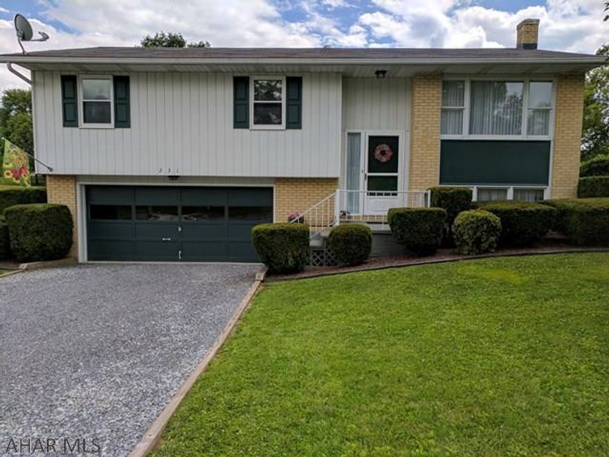 Welcome home!  This Bi-level home is spotless and waiting for your furniture.  Mature landscaping, and a large lawn, surround this 3 bedroom, 2 bath home.  There's also a deck off the kitchen/dining area, and a patio outside of the downstairs finished family room with a woodstove!  Enjoy the central air during the hot daytime hours, and relax on your deck in the evening and watch fireflies in your backyard. Make an appointment to check this house out before it's gone!