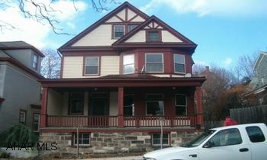 Lots of potential. 5 bedrooms 1 1/2 bath, natural woodwork, window seats, pocket doors, cherry kitchen, large rooms. Possible 6th bedroom. 1 car detached garage, newer roof. Needs TLC. SOLD AS IS.