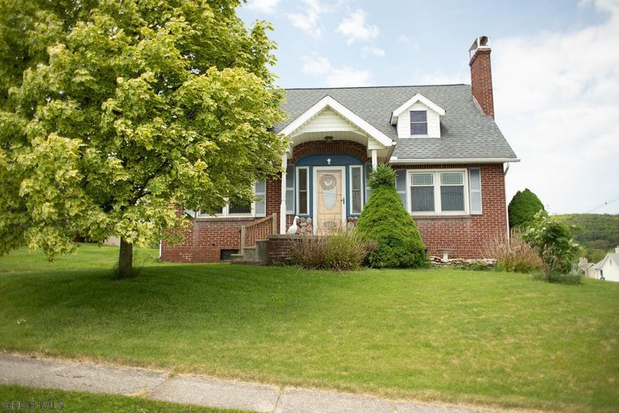 1.5 story brick house on a large corner lot!  Stone finished fireplace and hardwood floors throughout.  Schedule your showing today!