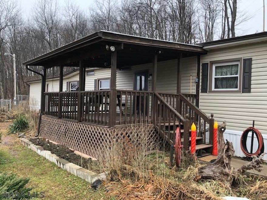 Looking for a well maintained property?  Beautiful singlewide home with a detached 1 car garage and two other outbuildings.  Home has many updates with a remodeled bathroom, beautiful front door, new kitchen sink and faucet, newer roof and windows all on 5+ acres.