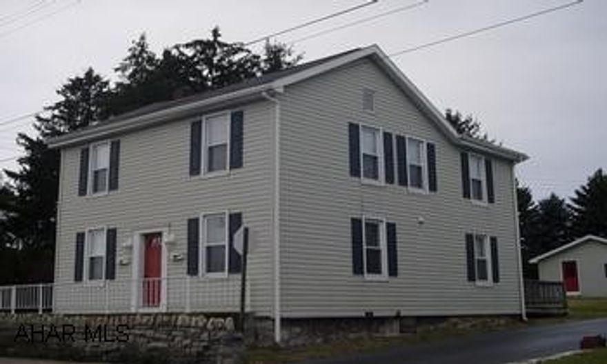 Remodeled duplex - could easily be made into a single family.  Each unit has two bedrooms, kitchen, bath, living room, plus a two car detached garage. Separate utilities.  One unit is electric heat and one unit is oil. There are two off street parking spaces.