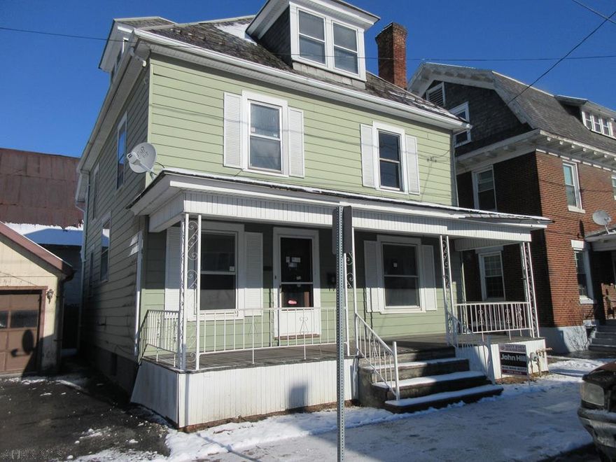 Large 2.5 story Huntingdon Borough home with loads of charm and potential. Needs some work, but could be perfect with loads of living space and 1 car detached garage. All original oak trim and stained glass. Large living room with original ornamental fireplace, den and dining room on first floor. 4 large bedrooms upstairs plus large attic with walk up stairs for storage or possible additional living space. AS-IS sale. Seller will make no repairs.