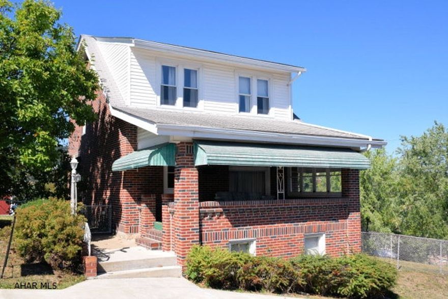 Brick home situated on four city lots. Hardwood floors under carpeting.  Nice fenced yard.  Needs some updating but has tons of potential.  Perfect starter home with good mechanics.